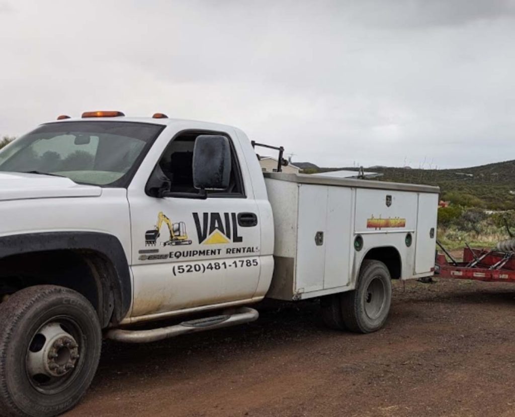 white truck with vail equipment rentals logo